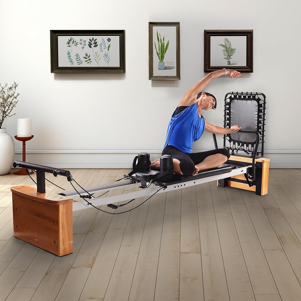 Stamina Products AeroPilates Board Pro XP557 Pilates Reformer with Oak Wood Base – Studio Grade for Home Use with Cardio Rebounder, Adjustable Foot Bar, 4 Resistance Springs, and Workout DVDs